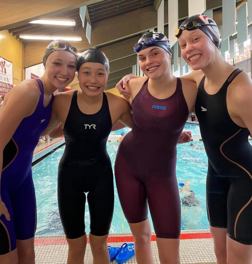 Girls' Swim & Dive Students at pool
