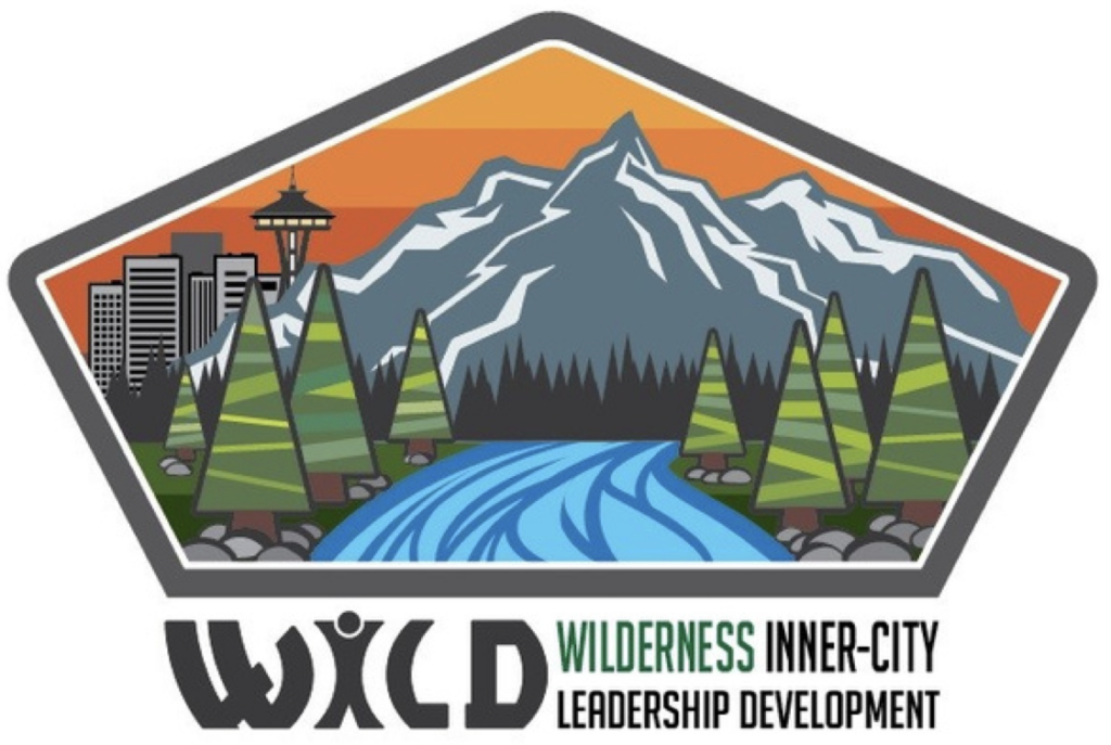 Text: Wilderness Inter-City Leadership Development. Image of Seattle Skyline and Mt Rainer