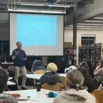 Greg Smith in Library with Parents at PTSA Meeting